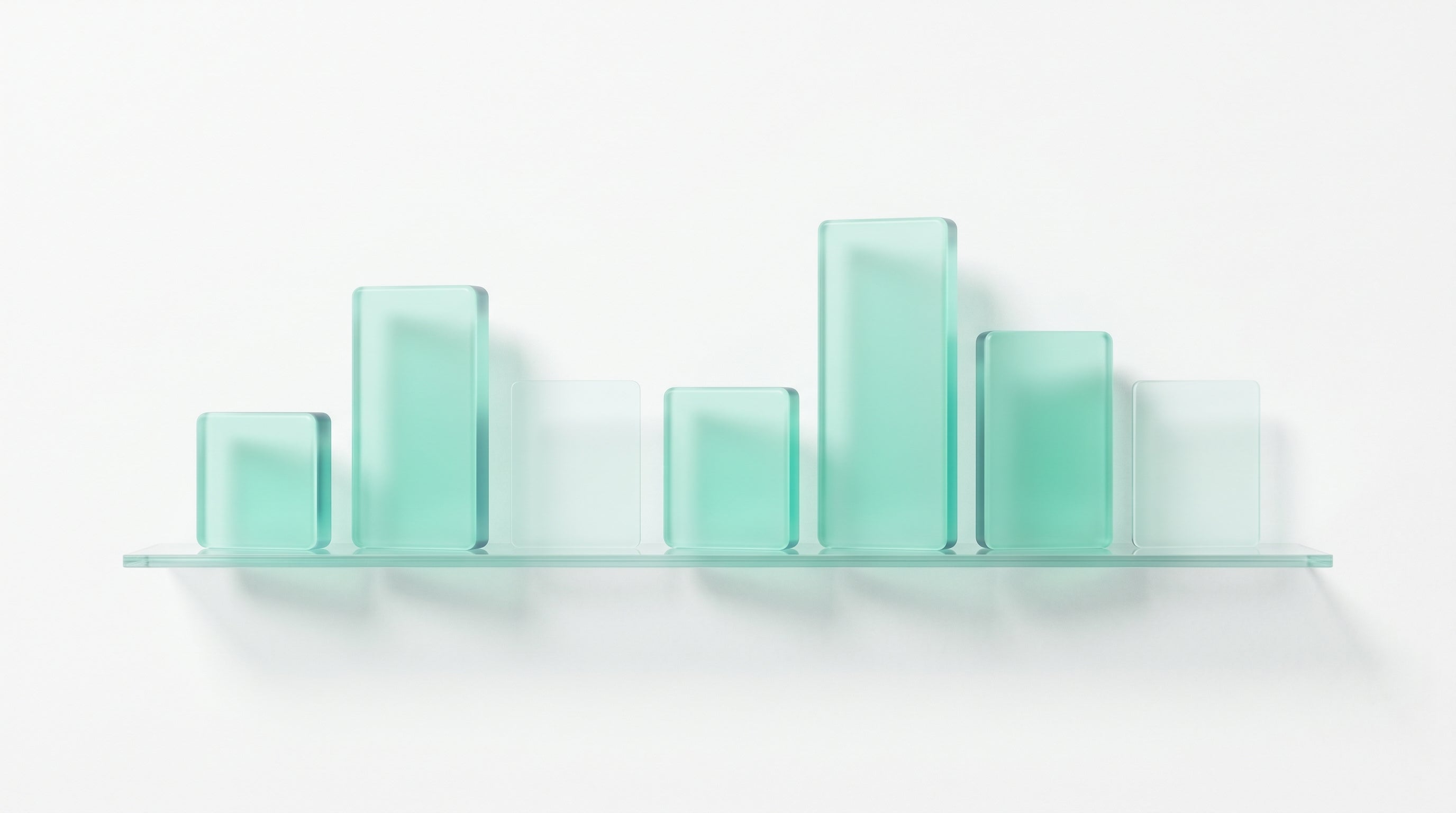A glass shelf of product tiles — some filled, some empty, room for the bench to grow