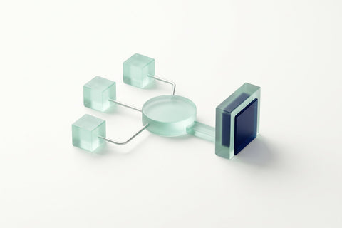 Three frosted glass cubes feeding one glass hub, with a single path to a navy checkpoint